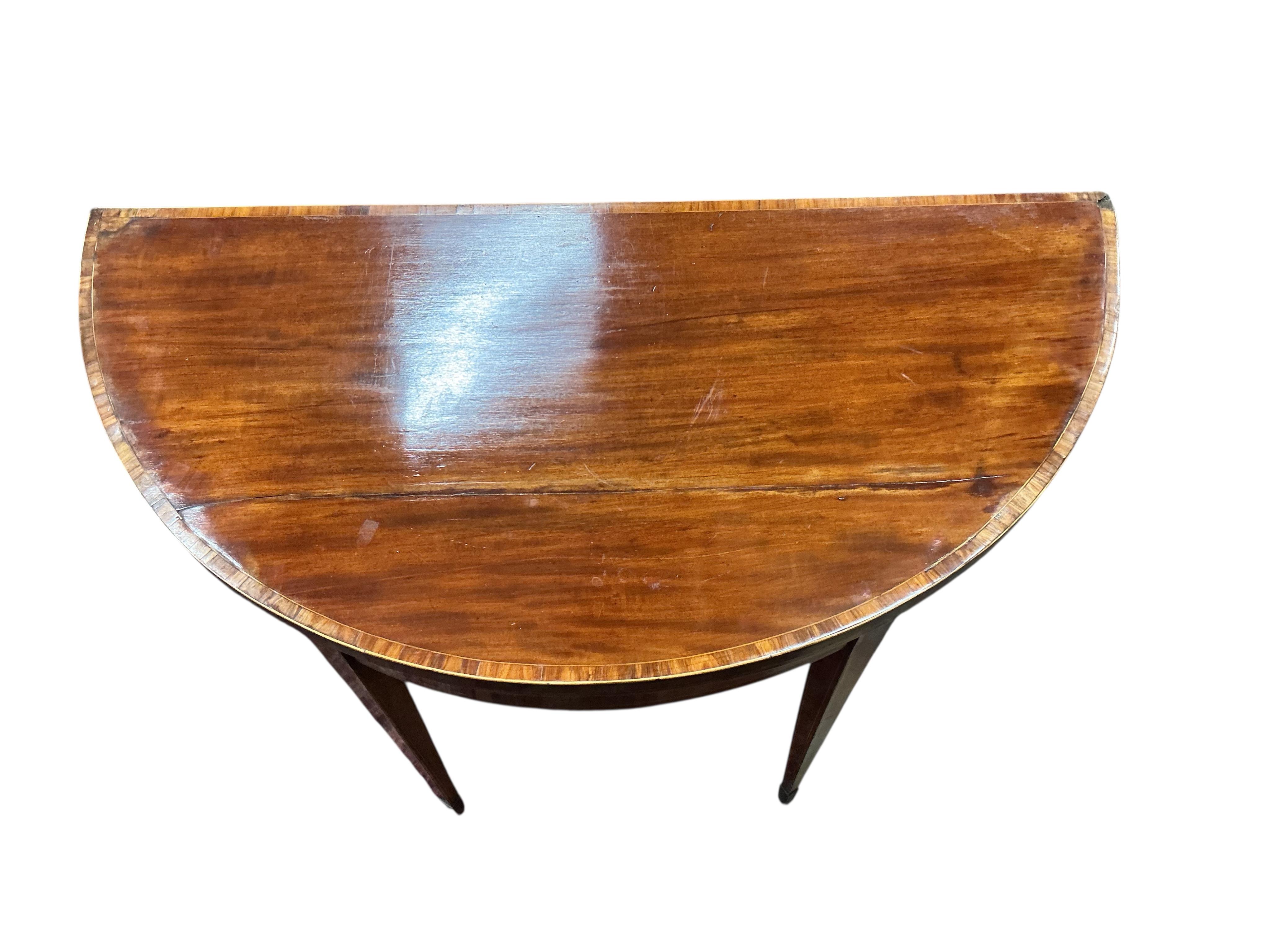 A George III tulip banded mahogany demi-lune folding card table, width 91cm, depth 45cm, height 74cm